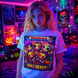 Person wearing a t-shirt with 'Voodoo Doll Heads' design in a colorful, neon-lit room.