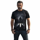 Man wearing a black t-shirt with a graphic design on a white background