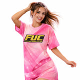 Woman wearing a pink t-shirt with 'FUC' logo on a white background