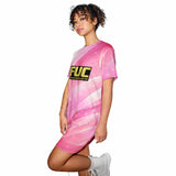 Person wearing a pink dress with a yellow 'FUC' logo on a white background